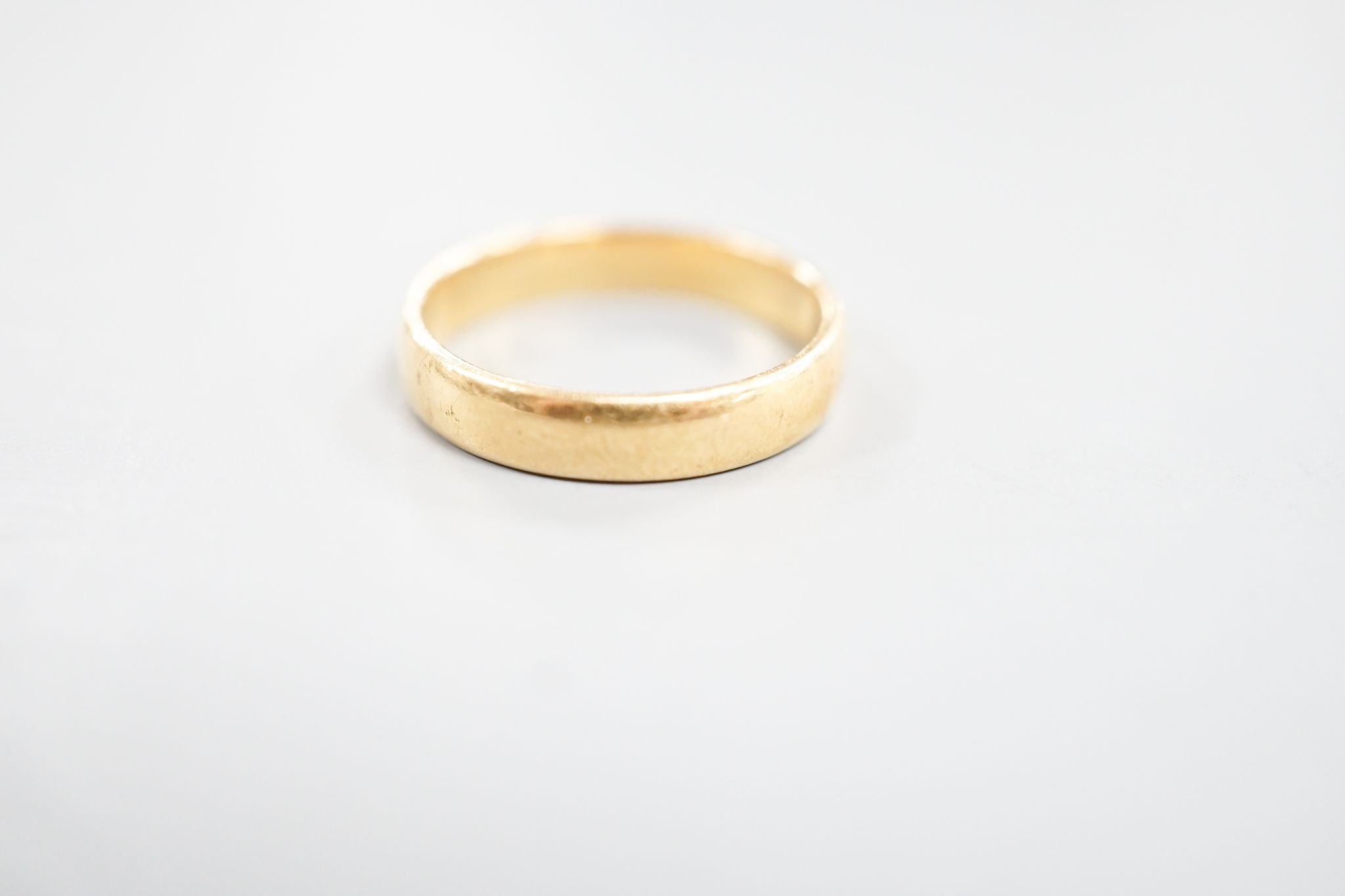A 22ct wedding band, size N, 4.3 grams.